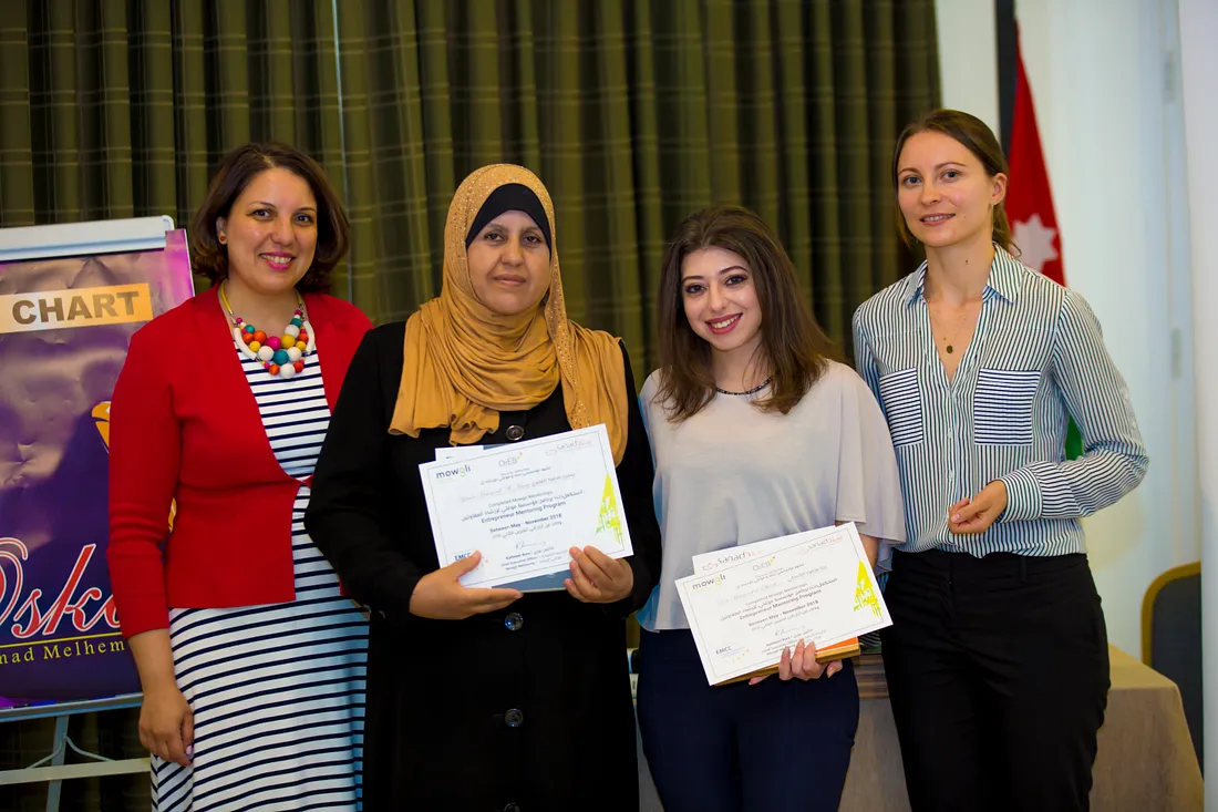 Syrian refugess receiving their mentoring certificates